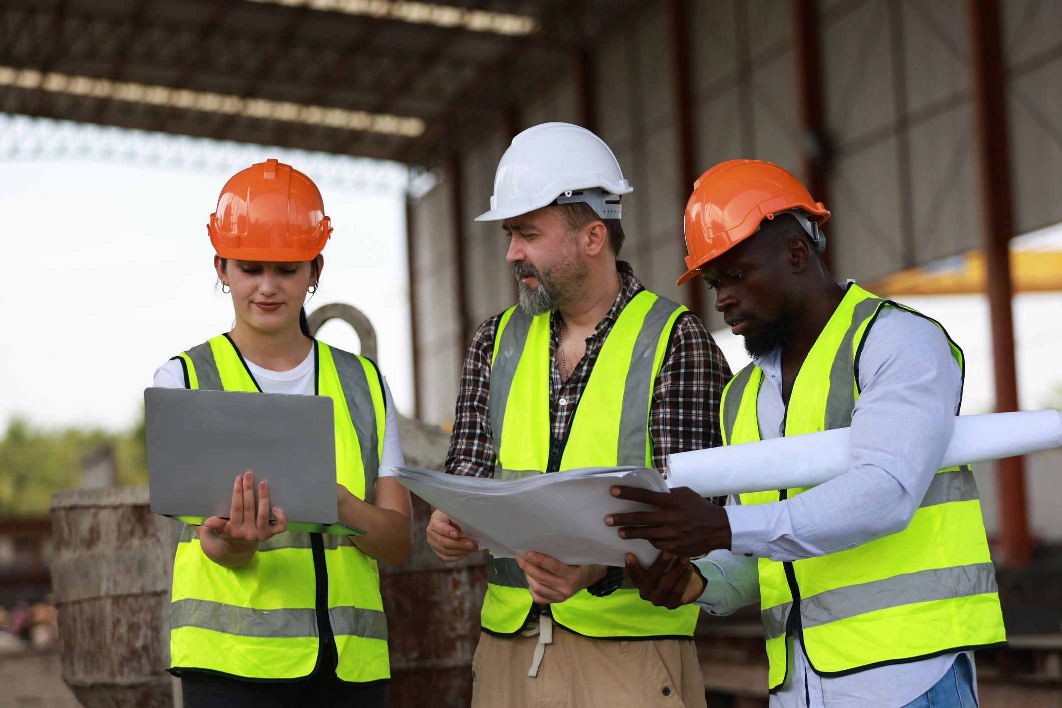 Civil engineer on site reviewing construction plans