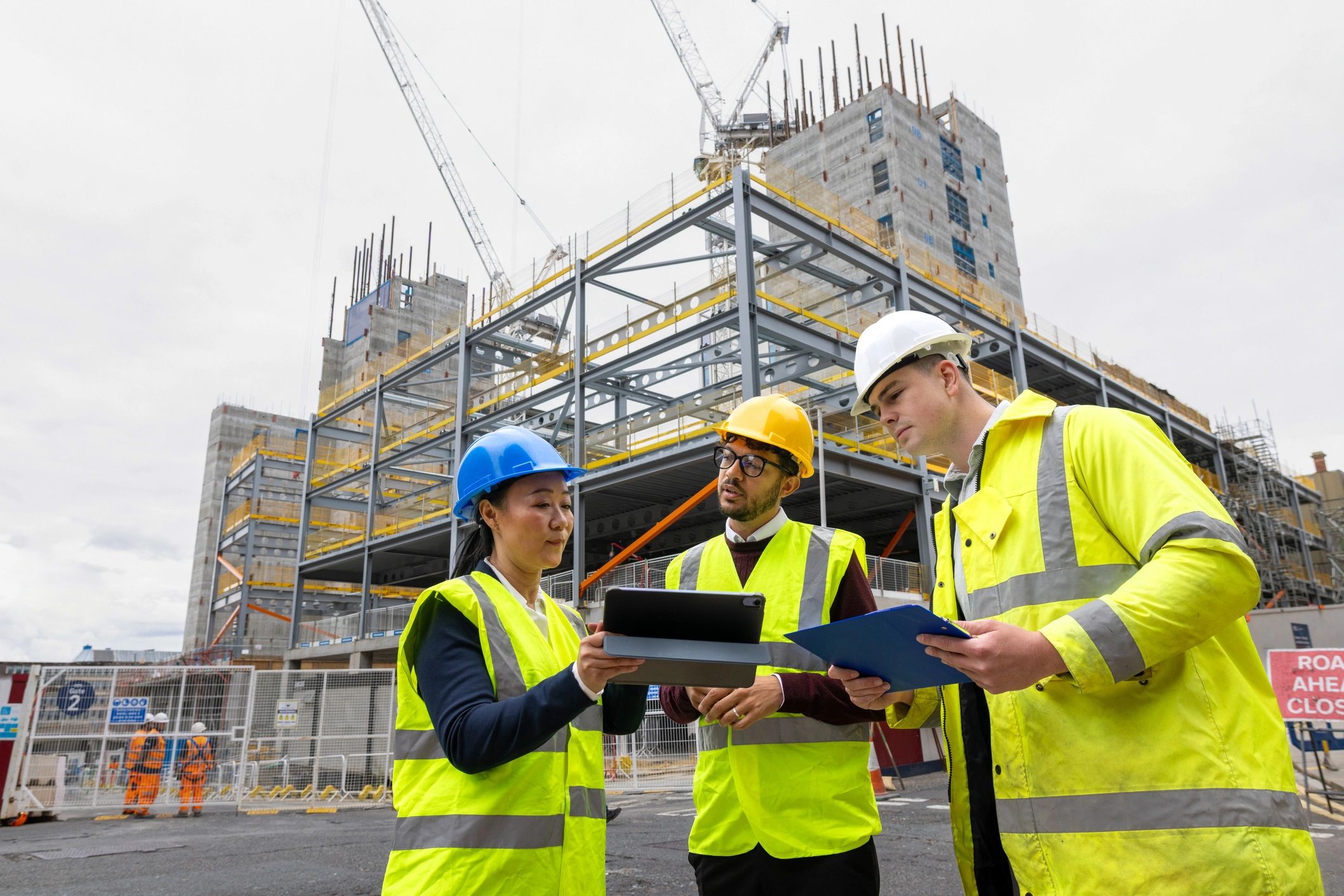 Project team reviewing construction plans on site