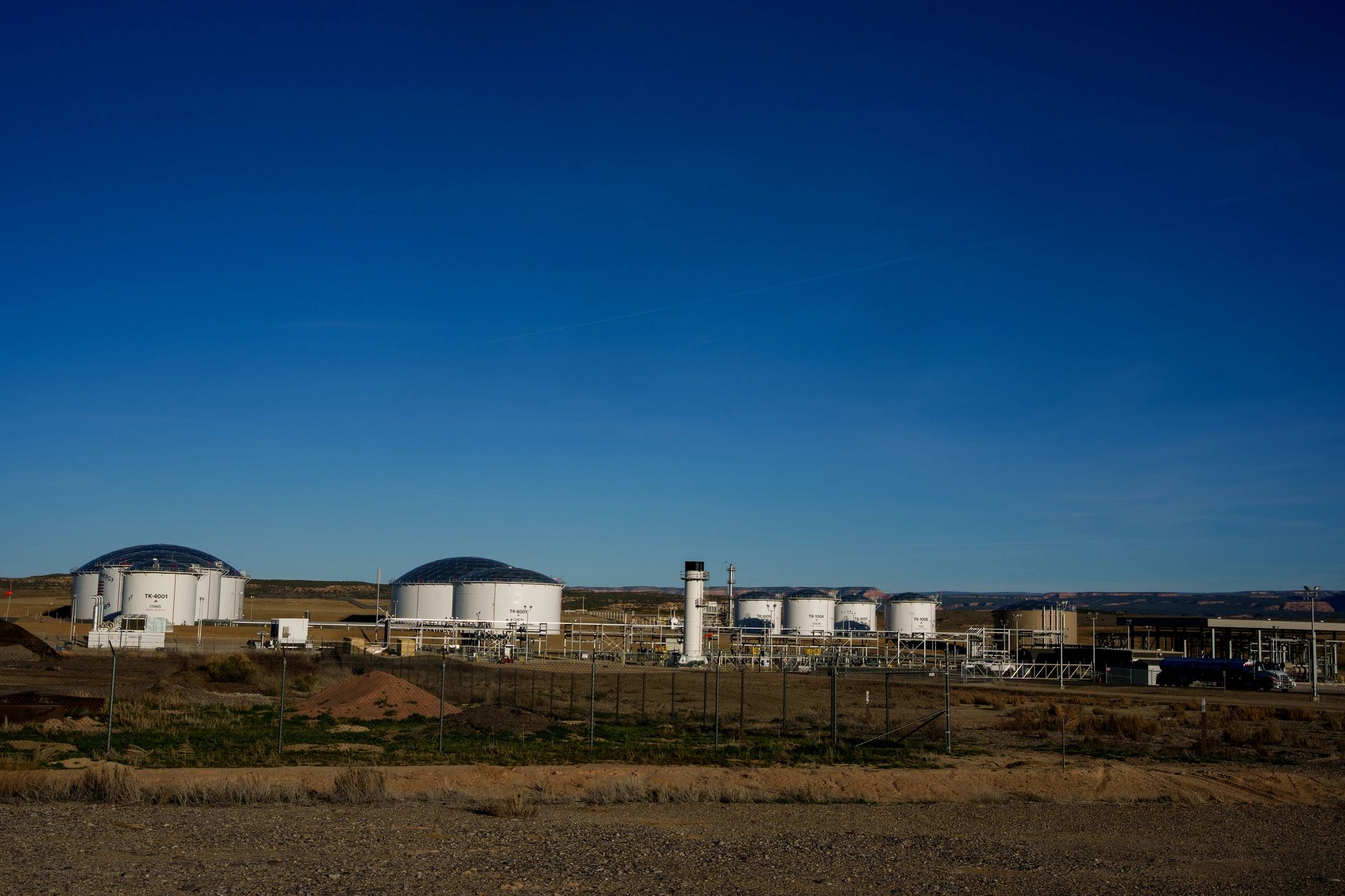 Fuel storage terminal with tanks in desert landscape